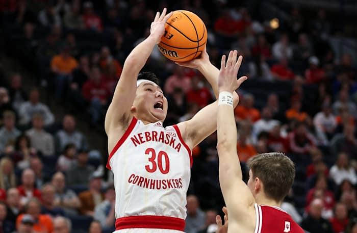 Mar 15, 2024; Minneapolis, MN, USA; Nebraska Cornhuskers guard Keisei Tominaga (30) shoots as Indiana Hoosiers guard Gabe Cupps (2) defends during the first half at Target Center.